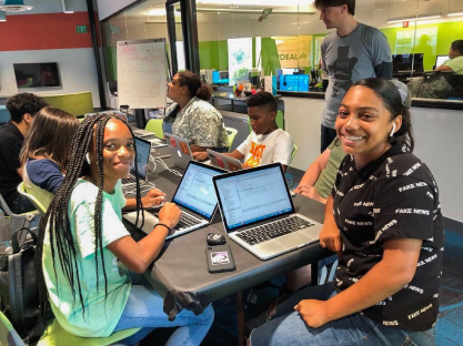 Students collaborating in coding workshop