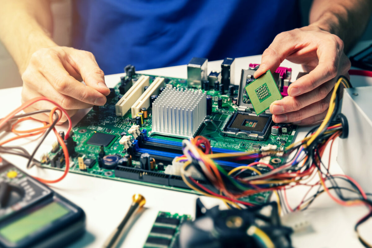 Computer Hardware Camp technician installing computer hardware